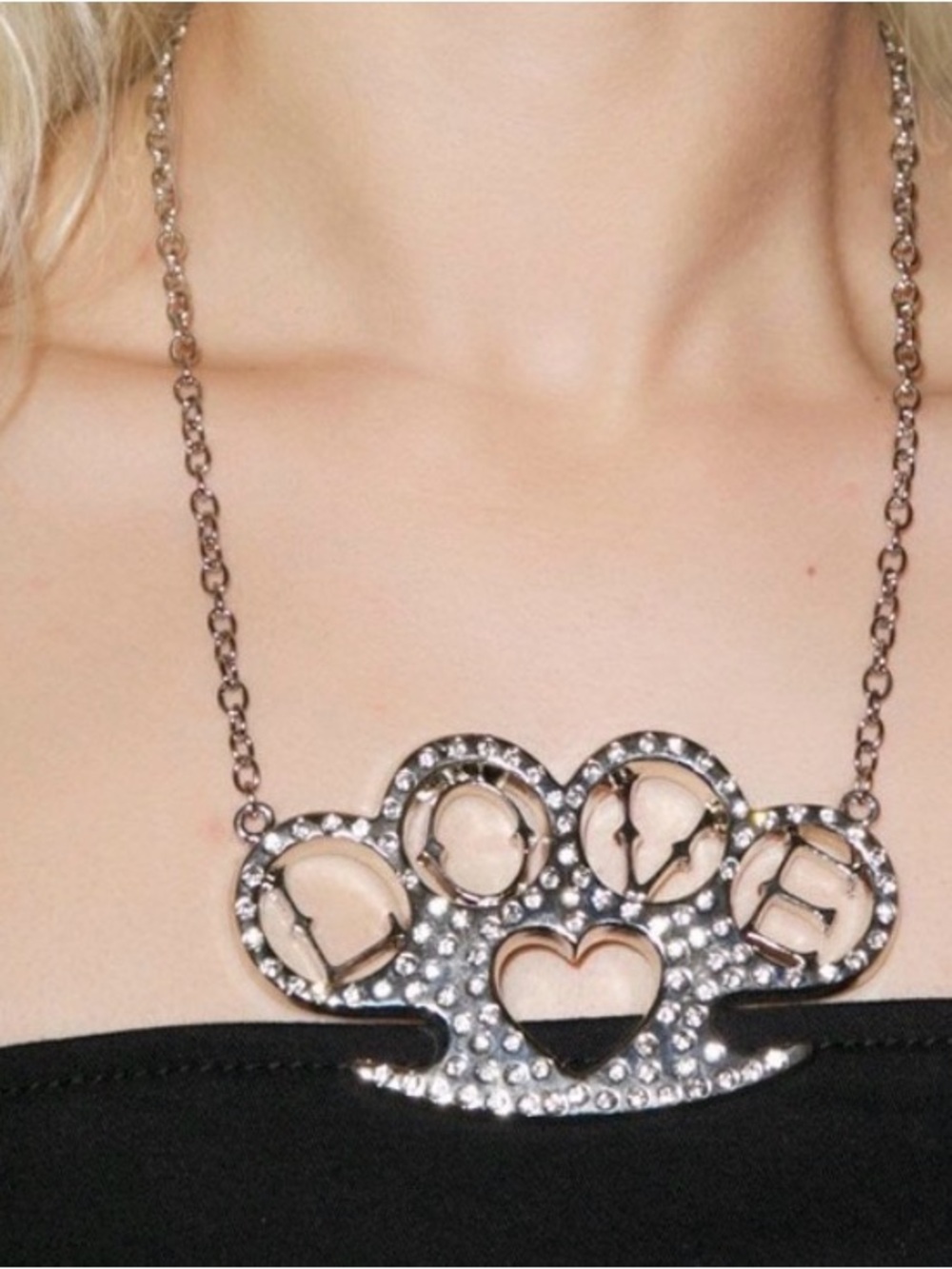 ISO any rock rebel brass knuckle necklace!